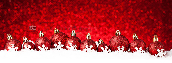 many christmas balls in the snow
