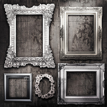 grungy room with silver frames and Victorian wallpaper